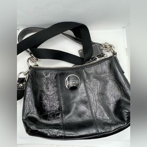 Y2K/2000s Black Coach shoulder bag with blue satin interior.